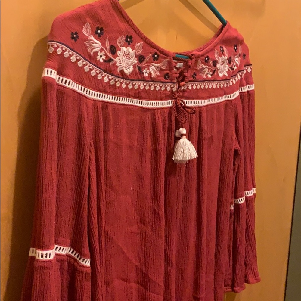 Red blouse with embroidered flowers. Great quality